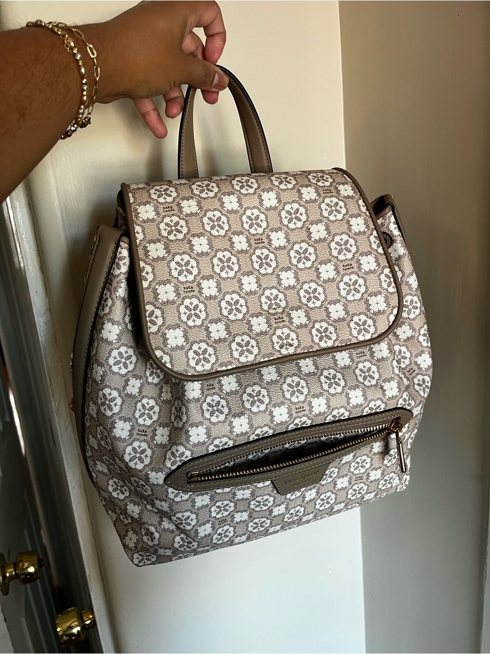 Kate spade bucket backpack- neutral pattern- comes with dust bag!
